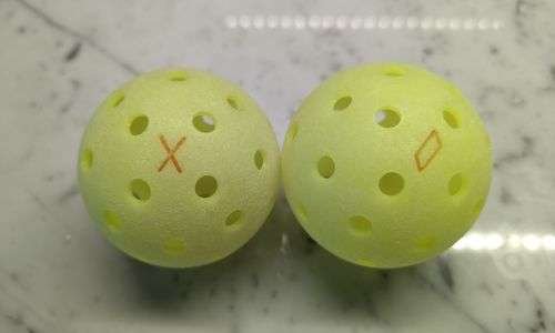 couple of Franklin X40 Pickleballs are on surface