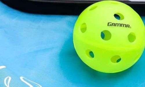 yellow color GAMMA Photon indoor pickleball ball on surface